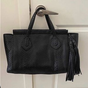 A Python GUCCI black top handle bag!! Great luxury bag for fashion enthusiasts!